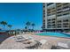 Pool area features comfortable lounge chairs and easy access to beachfront at 1480 Gulf Blvd # 109, Clearwater Beach, FL 33767