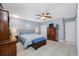 Bright bedroom with tile floors, neutral walls, and classic furniture at 14884 Cromwell Dr, Clearwater, FL 33764