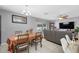 Cozy dining area adjacent to the living room, filled with lots of natural light at 14884 Cromwell Dr, Clearwater, FL 33764