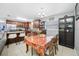 Well-lit dining room next to open kitchen with stainless appliances and granite countertops at 14884 Cromwell Dr, Clearwater, FL 33764