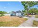 The home has an attached two car garage and driveway; the front yard needs some TLC at 14884 Cromwell Dr, Clearwater, FL 33764