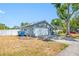 The home has an attached two car garage and driveway; the front yard needs some TLC at 14884 Cromwell Dr, Clearwater, FL 33764