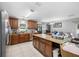 Spacious kitchen featuring wood cabinets, granite countertops, and stainless steel appliances at 14884 Cromwell Dr, Clearwater, FL 33764