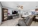 Comfortable living room with a large television and plentiful seating, perfect for relaxing at 14884 Cromwell Dr, Clearwater, FL 33764