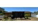 Spacious backyard featuring a screened lanai and beautiful landscaping at 150 Tompkins St, Port Charlotte, FL 33954