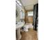 Well-lit bathroom with a pedestal sink, modern fixtures, and a shower-tub combination at 150 Tompkins St, Port Charlotte, FL 33954