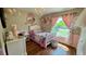 Bright bedroom featuring a chandelier, light-colored walls, and a charming princess-themed decor at 150 Tompkins St, Port Charlotte, FL 33954