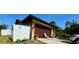 Attached garage and fenced yard in this single-Gathering home at 150 Tompkins St, Port Charlotte, FL 33954