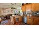 Well-equipped kitchen with a center island, stainless steel appliances, and dark backsplash, offering a functional and stylish space at 150 Tompkins St, Port Charlotte, FL 33954