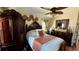 Elegant main bedroom featuring a cozy bed, ceiling fan, and decorative accents at 150 Tompkins St, Port Charlotte, FL 33954
