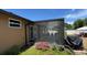 Screened patio with outdoor access; great for enjoying the weather at 150 Tompkins St, Port Charlotte, FL 33954