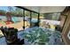 Spacious screened porch with seating and views of the large backyard play area at 150 Tompkins St, Port Charlotte, FL 33954