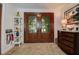Elegant foyer with glass paneled double doors, beautiful wood trim and decorative accents at 17519 Drake Ct, Lutz, FL 33559
