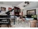 Stylish living room featuring a grand piano, eye-catching art, and unique decor at 17519 Drake Ct, Lutz, FL 33559
