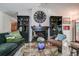 Charming living room boasts a cozy fireplace, eclectic decor, and plush seating at 17519 Drake Ct, Lutz, FL 33559
