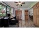 Office space featuring a large window, closet, and hardwood floors at 17519 Drake Ct, Lutz, FL 33559