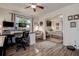A view from the office looking into the bedroom with natural light from two windows at 17519 Drake Ct, Lutz, FL 33559