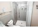 Modern bathroom with gray tile shower, recessed shelves, and elegant fixtures at 1975 W Bay Dr # 301, Largo, FL 33770
