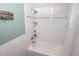 Well-maintained bathroom featuring a shower-tub combo with white tile surround and modern fixtures at 1975 W Bay Dr # 301, Largo, FL 33770
