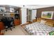 Spacious bedroom with comfortable bed, dedicated workspace, and ample natural light at 1975 W Bay Dr # 301, Largo, FL 33770