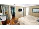 Bedroom with hardwood floors provides access to laundry and other areas at 1975 W Bay Dr # 301, Largo, FL 33770