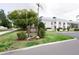 Exterior view of the Belleair Oaks Condominiums with a sign at 1975 W Bay Dr # 301, Largo, FL 33770