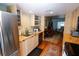 Bright kitchen featuring stainless steel appliances, and wooden cabinets at 1975 W Bay Dr # 301, Largo, FL 33770