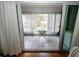 Sunroom with tiled floors and a small table and chairs for relaxing at 1975 W Bay Dr # 301, Largo, FL 33770