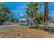 Charming bungalow-style home with a lush, tropical landscaped yard and mature palm trees at 2001 29Th N Ave, St Petersburg, FL 33713