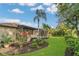 Beautifully landscaped backyard with screened lanai and mature plantings at 20632 Broadwater Dr, Land O Lakes, FL 34638