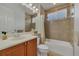 This bathroom features a single sink, a tub, and tiled floors at 20632 Broadwater Dr, Land O Lakes, FL 34638