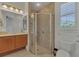 This bathroom features a shower, a single sink, and tiled floors at 20632 Broadwater Dr, Land O Lakes, FL 34638