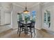 Cozy breakfast nook bathed in natural light, with views of the pool and outdoor living space at 20632 Broadwater Dr, Land O Lakes, FL 34638
