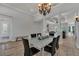 Well-lit dining room with an elegant chandelier and easy access to the kitchen and living areas at 20632 Broadwater Dr, Land O Lakes, FL 34638