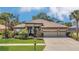 Charming home with lush lawn, landscape beds, and double-door entrance at 20632 Broadwater Dr, Land O Lakes, FL 34638