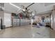 Bright and spacious garage with built-in storage cabinets and overhead racks offers ample room for vehicles and storage at 20632 Broadwater Dr, Land O Lakes, FL 34638