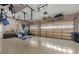 Spacious two car garage offering ample storage and organization with built in shelving and hanging storage system at 20632 Broadwater Dr, Land O Lakes, FL 34638