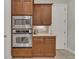 Efficient kitchen with built-in oven, microwave, ample counter space, and seamlessly integrated storage at 20632 Broadwater Dr, Land O Lakes, FL 34638