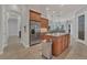 Well-equipped kitchen with stainless steel appliances, granite countertops, and seamlessly integrated breakfast bar area at 20632 Broadwater Dr, Land O Lakes, FL 34638