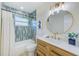 Modern bathroom with a tub, vanity, and stylish tile work at 2220 Calexico S Way, St Petersburg, FL 33712