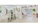 Open-concept layout connects dining, living, and kitchen areas for a cohesive and inviting living space at 2220 Calexico S Way, St Petersburg, FL 33712