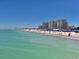 Scenic beach view with turquoise water and residential buildings in the background on a bright day at 2254 Norwegian Dr # 46, Clearwater, FL 33763