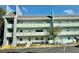 Exterior daytime view of the building featuring a mid-rise facade and parking at 2254 Norwegian Dr # 46, Clearwater, FL 33763