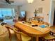 Inviting living room featuring a large table, comfortable seating, and ceiling fan at 2254 Norwegian Dr # 46, Clearwater, FL 33763