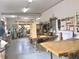Well-lit workshop with multiple work benches, tools, and equipment for woodworking projects at 2254 Norwegian Dr # 46, Clearwater, FL 33763