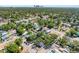 Expansive aerial view showcasing the neighborhood, lush greenery, and glimpses of the city skyline at 2322 21St S St, St Petersburg, FL 33712