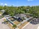 Aerial view showcases the fenced in yard of the home with mature trees at 2322 21St S St, St Petersburg, FL 33712