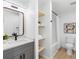 Contemporary bathroom features updated vanity, stylish mirror, and shower with modern fixtures at 2322 21St S St, St Petersburg, FL 33712