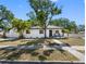 Charming single-story home with a neatly manicured lawn, walkway, and a cozy front porch at 2322 21St S St, St Petersburg, FL 33712