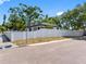 Corner lot with street signage features a freshly painted, fenced home and lush landscaping at 2322 21St S St, St Petersburg, FL 33712